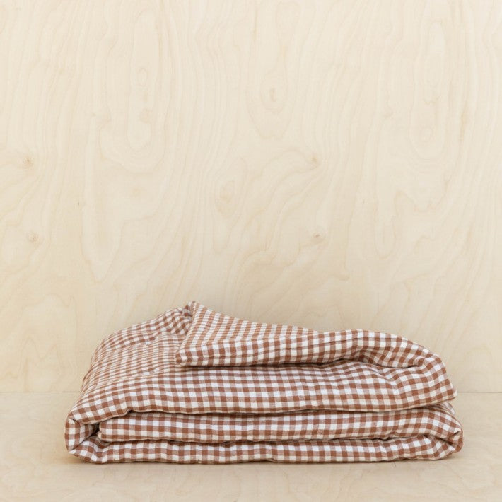 Colchoneta de lino Brique de Gabrielle Paris - vista lateral | Nomad Interiors